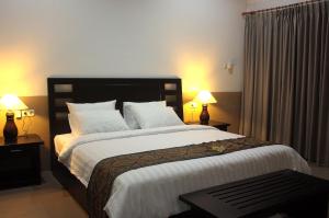 Ein Bett oder Betten in einem Zimmer der Unterkunft Tulamben Dive Resort