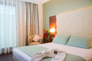 Katil atau katil-katil dalam bilik di AZ Hôtels Kouba