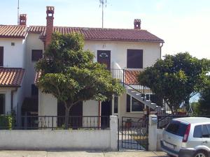 a white van parked in front of a house at Brko Apartment in Medulin +8 photos