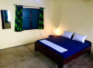 Ένα ή περισσότερα κρεβάτια σε δωμάτιο στο Royal German Guest House