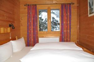Letto o letti in una camera di Chalet Edelweiss