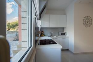 Kuchyň nebo kuchyňský kout v ubytování Apartment Sunce