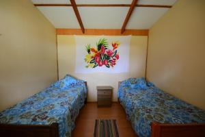 Letto o letti in una camera di Camping Hostal Tipanie Moana Aeropuerto Centro