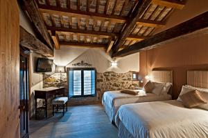 Posteľ alebo postele v izbe v ubytovaní Castello di Buttrio