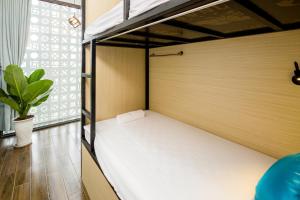 Letto o letti in una camera di Fedora Hostel