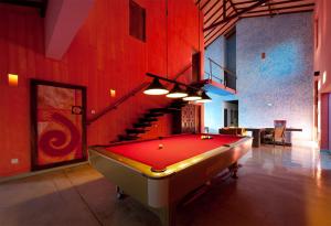 a living room with a large red fire place at Dickman Resort "The Boutique Hotel" in Negombo