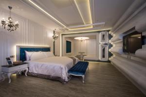 Postel nebo postele na pokoji v ubytování U-Her Hotel
