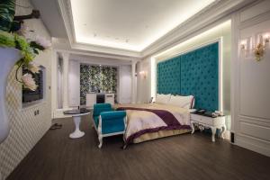 Postel nebo postele na pokoji v ubytování U-Her Hotel
