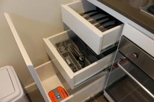 a small kitchen with a tool drawer and a sink at Exquisite Family Home +Parking, Close to CBD in Sydney