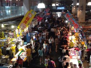 a large crowd of people walking around a market at Fukuoka Guesthouse Little Asia Kokura in Kitakyushu