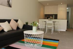 A seating area at Exquisite Family Home +Parking, Close to CBD