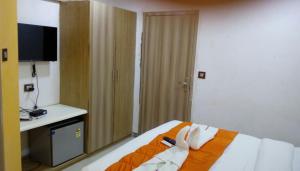 Postel nebo postele na pokoji v ubytování Setrac Orange Hotel