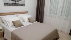 Postel nebo postele na pokoji v ubytování Apartment Sunce