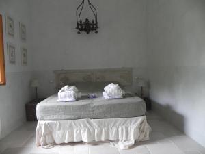 a bedroom with a bed with towels on it at Locanda di Terramare in Gabbro