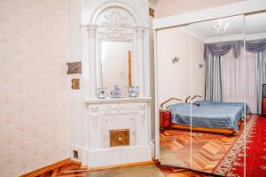 a bedroom with a fireplace and a bed in it at Hotel Park Lion Bridge in Saint Petersburg