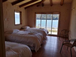 En eller flere senge i et værelse på Patagonia 47g