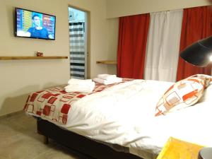 Postel nebo postele na pokoji v ubytování Hostal El Korú