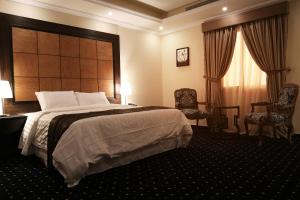 מיטה או מיטות בחדר ב-Sakan com Jeddah