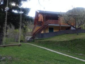 a house sitting on top of a grassy hill at la terrasse in Saint-Étienne-de-Tinée