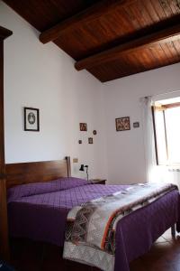Postel nebo postele na pokoji v ubytování La Locanda del Collaccio