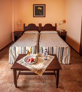 Postel nebo postele na pokoji v ubytování Albenzaire Hotel Asador