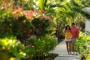 a woman and a girl walking down a sidewalk at Bay View Suites Paradise Island in Nassau