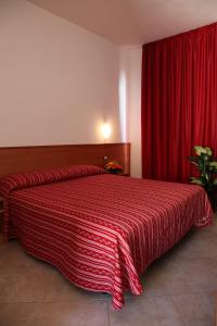 Postel nebo postele na pokoji v ubytování Luigiane B&B