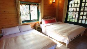 Postel nebo postele na pokoji v ubytování Old Farmer Homestay