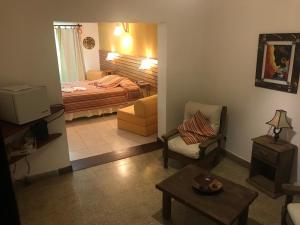 Postel nebo postele na pokoji v ubytování Hotel Complejo Najul Suites-Solo Adultos