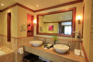 a bathroom with two sinks and a mirror at The Emerald Cove Koh Chang in Ko Chang