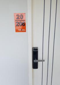 a door with a speed limit sign on it at The Idol Bangsaen 206 in Bangsaen