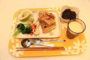 a plate of food on a table with a plate of food at 500Km Home in Hualien City
