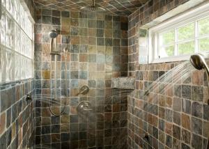 a bathroom with a shower with a shower head at Sugar Hill Inn in Sugar Hill