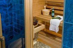 a sauna with a bottle of wine and a towel at Sugar Hill Inn in Sugar Hill