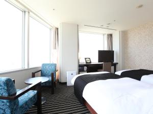 Postel nebo postele na pokoji v ubytování APA Hotel & Resort Tokyo Bay Makuhari
