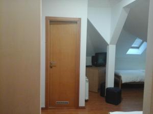 Postel nebo postele na pokoji v ubytování Garni Hotel Vila Drina