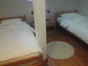 Postel nebo postele na pokoji v ubytování Garni Hotel Vila Drina