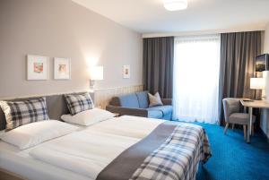 Posteľ alebo postele v izbe v ubytovaní Hotel Gasthof Zum Kirchenwirt