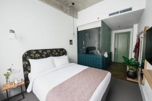 Letto o letti in una camera di Hotel Monopoli