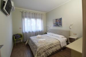 Postel nebo postele na pokoji v ubytování San Andreas Suites
