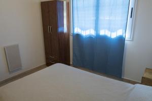 
Una cama o camas en una habitación de Casa con pileta en Villa General Belgrano
