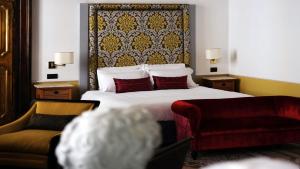 Postel nebo postele na pokoji v ubytování Nobildonne Relais