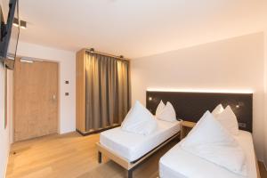 Voodi või voodid majutusasutuse Belvenu Boutique Hotel toas