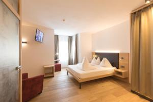 Voodi või voodid majutusasutuse Belvenu Boutique Hotel toas