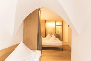 Voodi või voodid majutusasutuse Belvenu Boutique Hotel toas