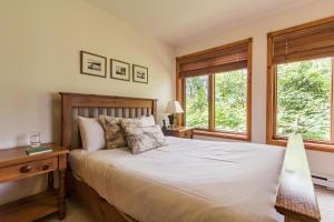Postel nebo postele na pokoji v ubytování Clairière by Rendez-Vous Mont-Tremblant