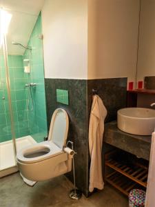 a bathroom with a toilet and a sink at Apartments Uppe Villa in Lisbon