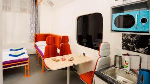 a small room with a kitchen and a sink at METRO Apartment Prague by Main Train and Bus Station in Prague