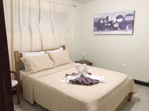 Postel nebo postele na pokoji v ubytování Hotel Casa Telma