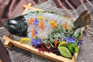 a plate of food with a fish on top at Kitaguni Grand Hotel in Rishirifuji +26 photos